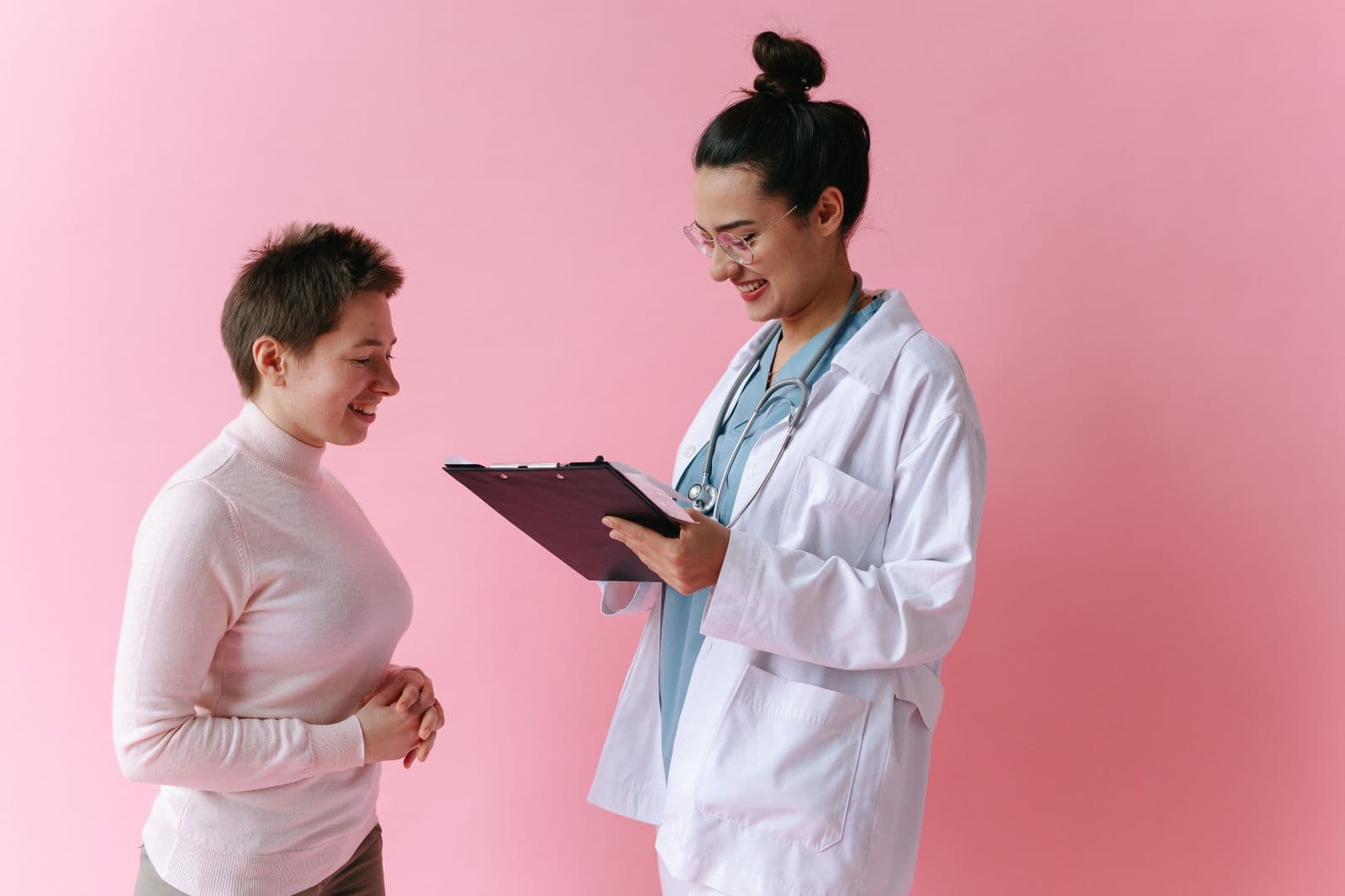 A pharmacist talking a patient through their new medicine