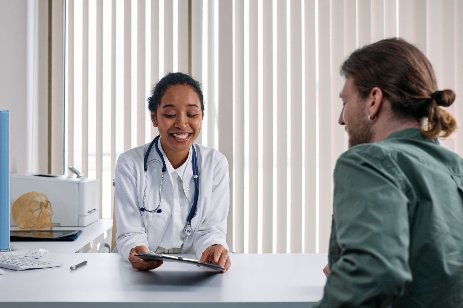 A relaxed private healthcare consultation at a desk